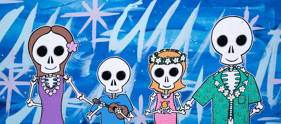 Day of the Dead-style skeleton family dressed in Hawaiian attire — aluminum reproduction by Maui artist Welzie