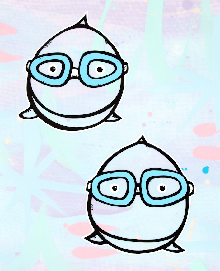 Two round characters wearing blue snorkel goggles — aluminum reproduction by Maui artist Welzie