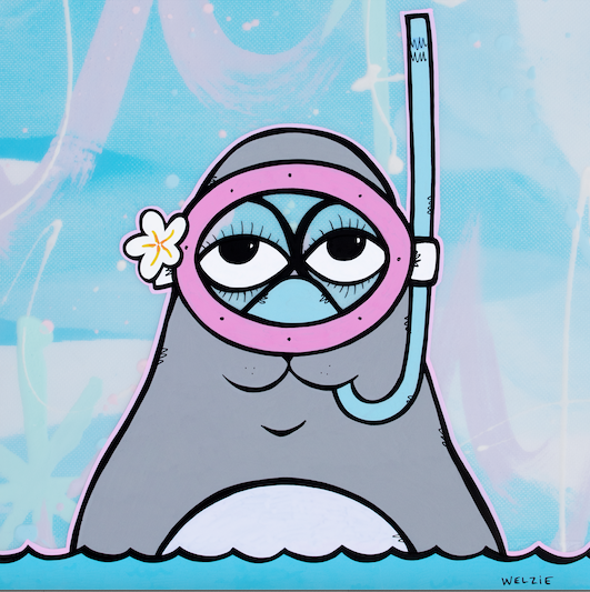 Gray seal character wearing a pink snorkel mask and flower — aluminum reproduction by Maui artist Welzie