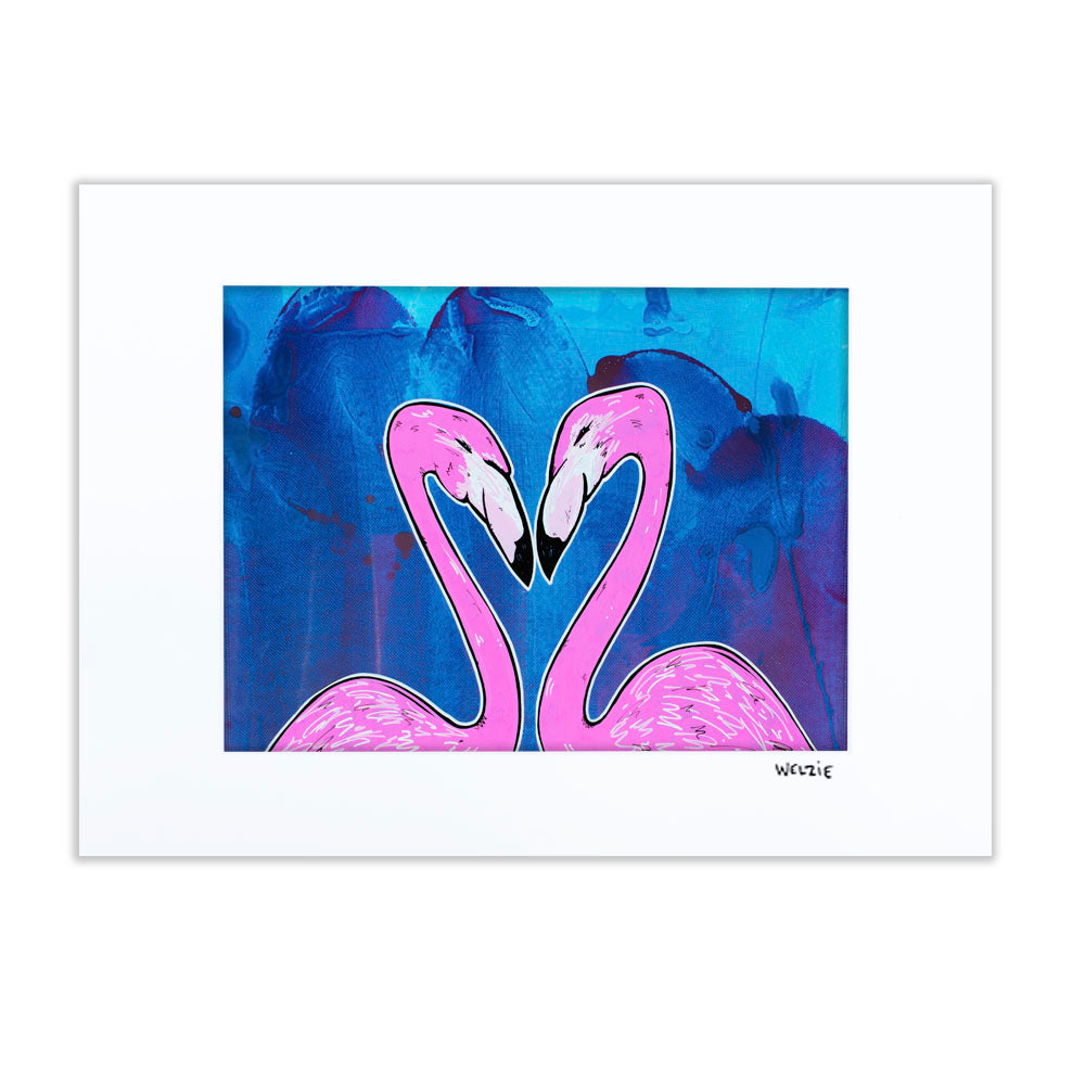 Two pink flamingos facing each other, their necks forming a heart shape — matted fine art print by Maui artist Welzie