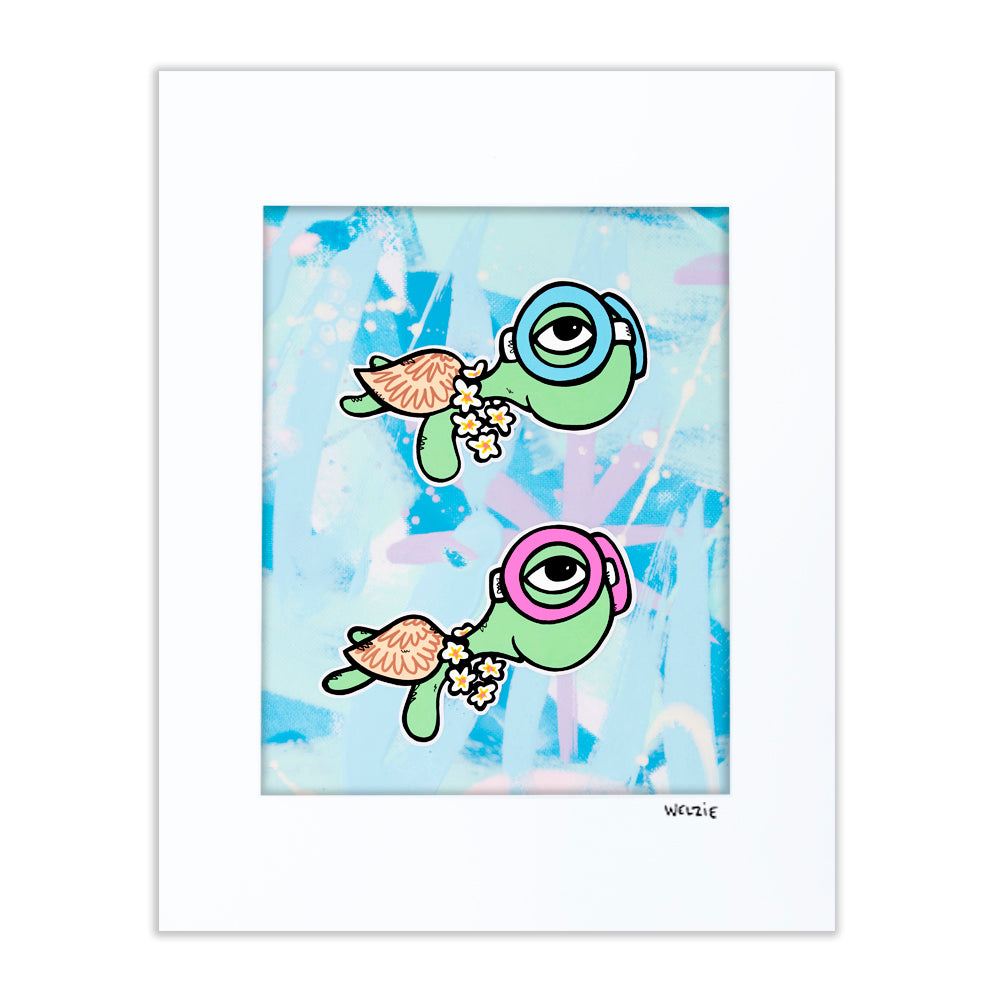 Two green turtle characters wearing pink and blue snorkel masks — matted fine art print by Maui artist Welzie