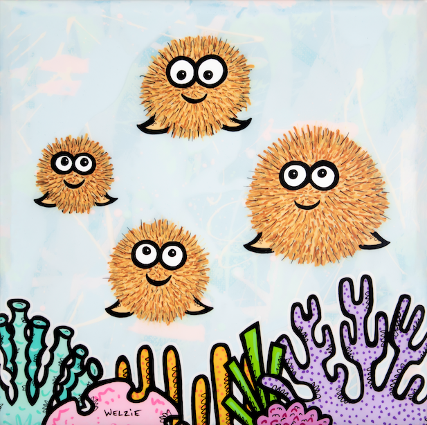 Four round pufferfish characters with big expressive eyes — aluminum reproduction by Maui artist Welzie